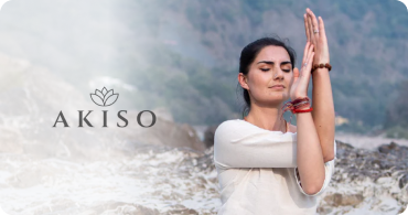 A serene image of a woman practicing yoga outdoors, representing Akiso’s holistic brand, with the Akiso logo placed prominently on the left side.
